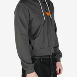Grey hoodie  worn by a person, showing the hoodie's fit