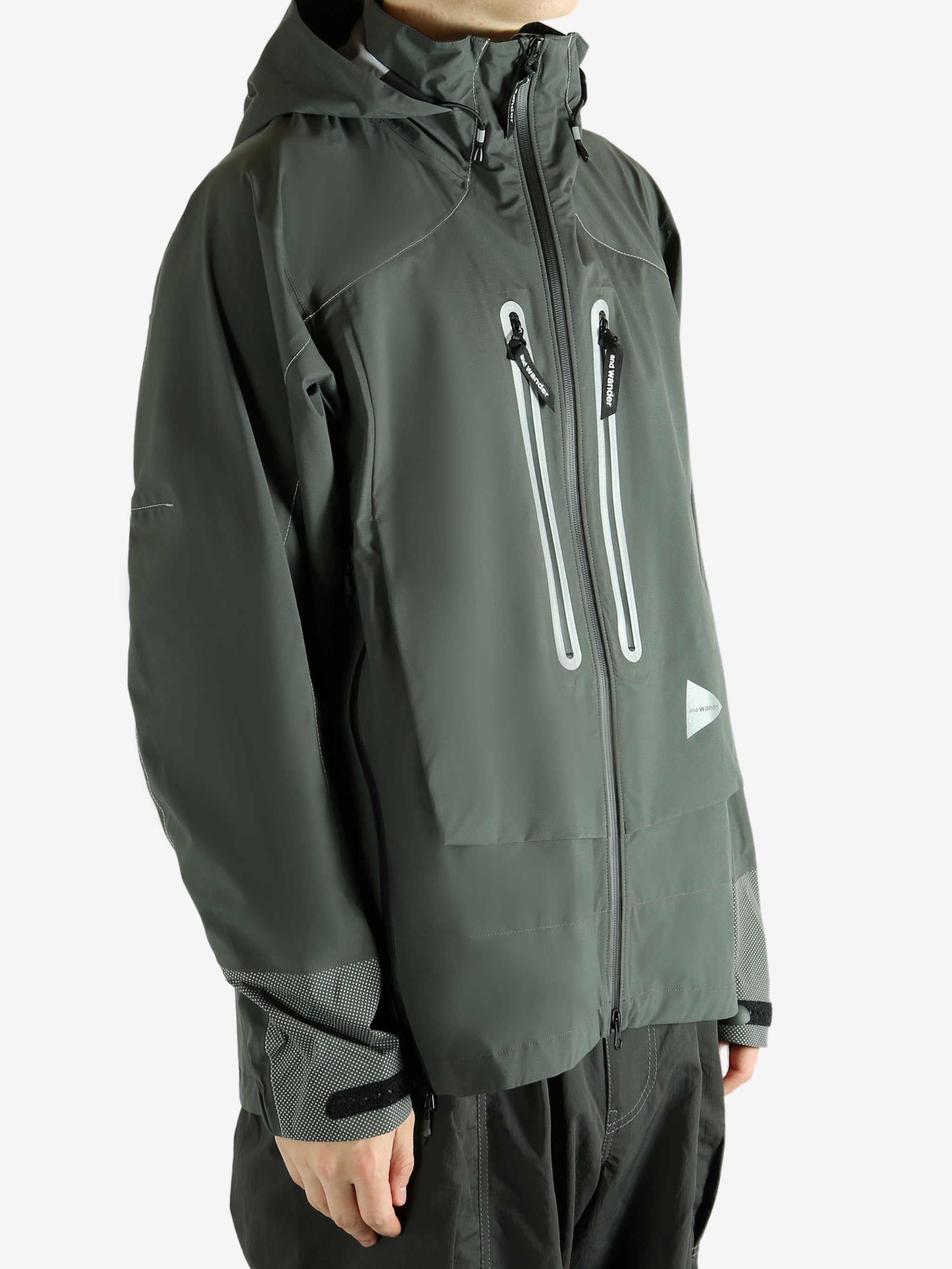 Green coat worn by a person, showing the coat fit