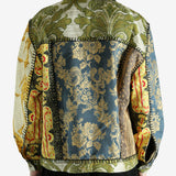 Green jacket worn by a person, showing the jacket‘s fit