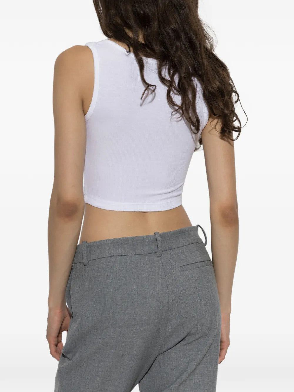White top worn by a person, showing the top fit