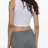 White top worn by a person, showing the top fit