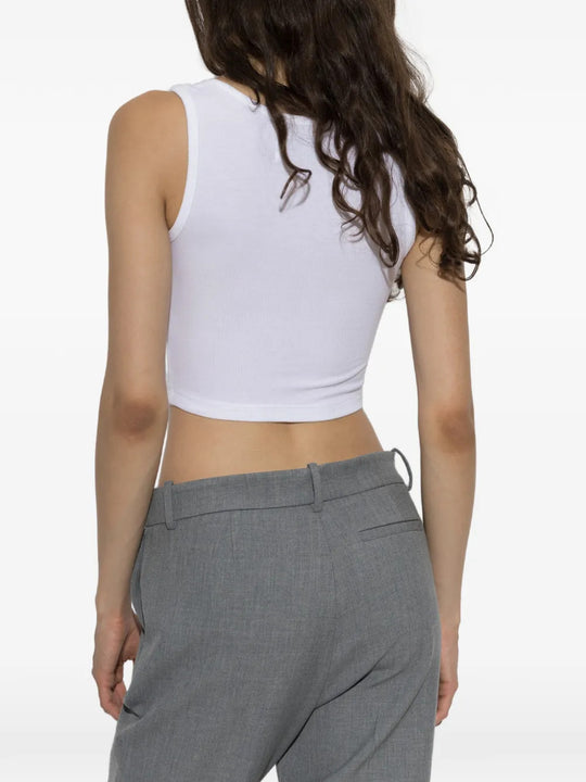 White top worn by a person, showing the top fit