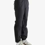 Black pants worn by a person showing the pants fit