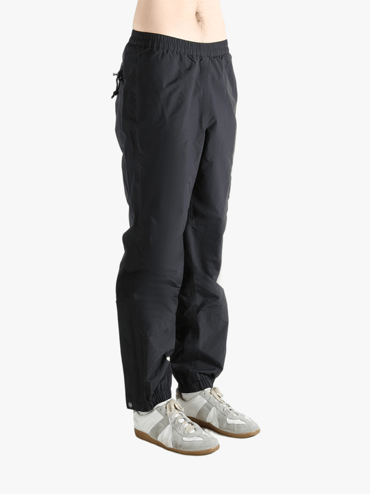 Black pants worn by a person showing the pants fit