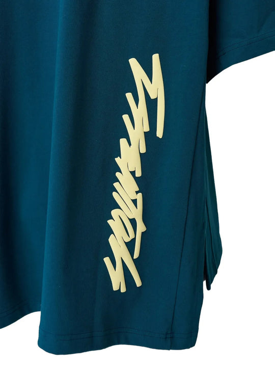 Close up of Green t-shirt, showing texture of the 100% cotton fabric