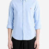 Blue shirt worn by a person, showing the shirt fit
