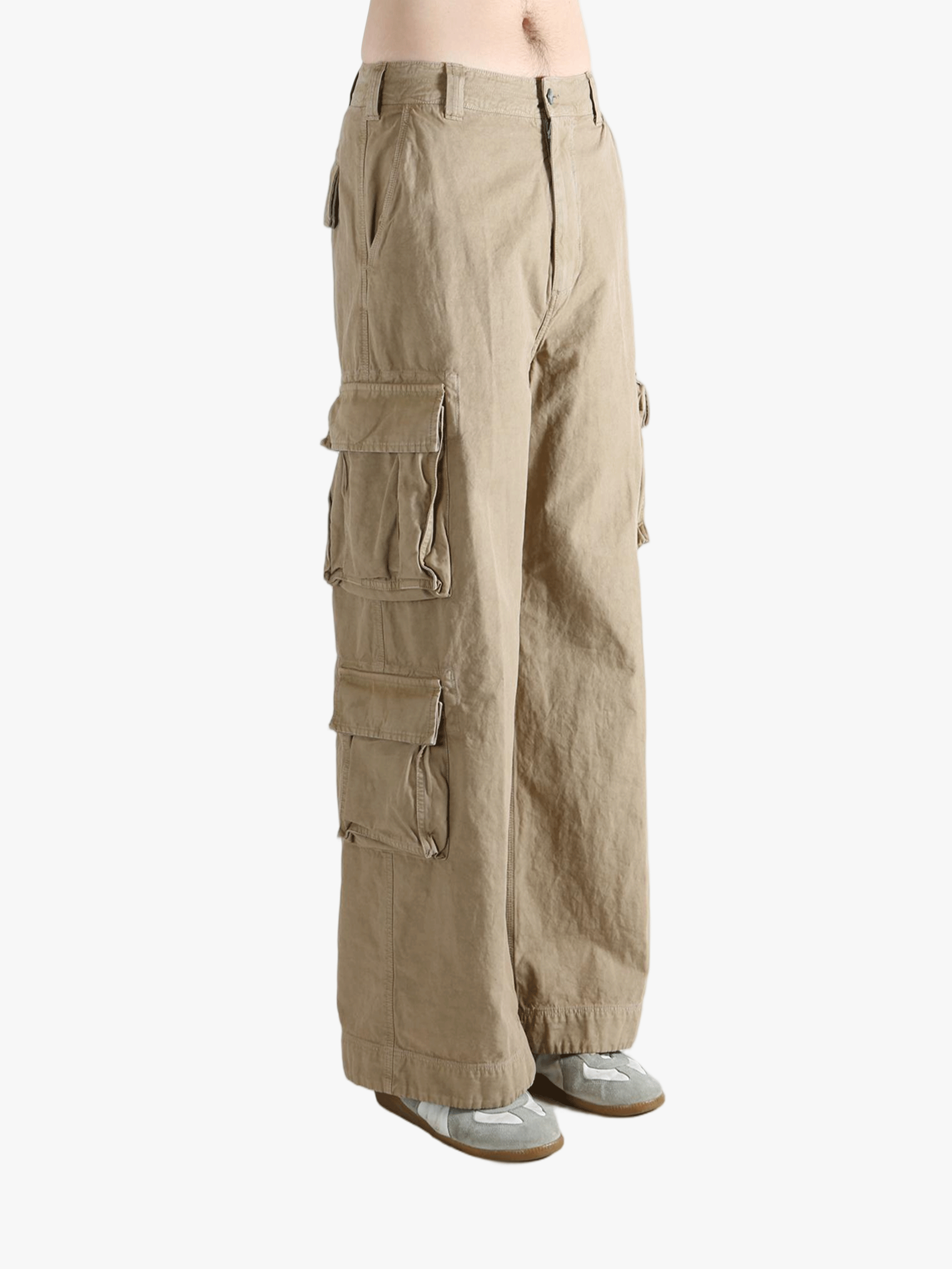 Brown pants worn by a person, showing the pants' fit