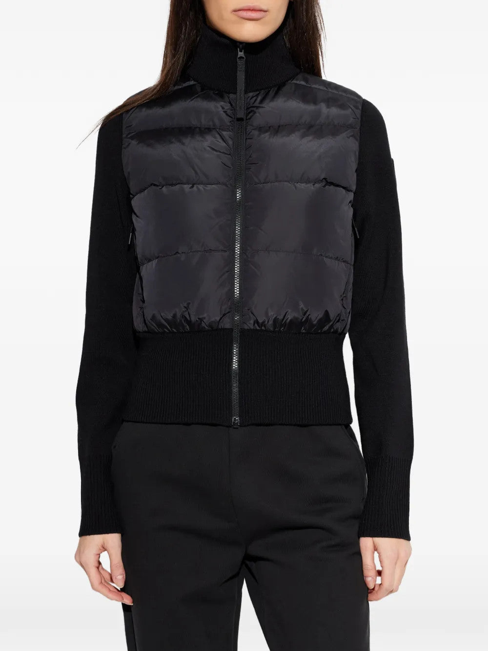 Black jacket worn by a person, showing the jacket fit
