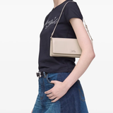 White bags worn by a person, showing the bags fit