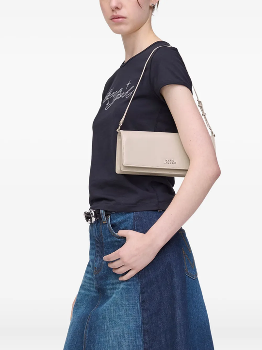 White bags worn by a person, showing the bags fit