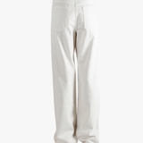 White pant worn by a person, showing the pant's fit