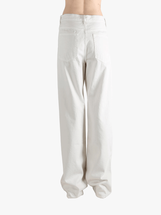 White pant worn by a person, showing the pant's fit