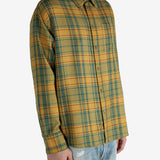 Yellow shirt worn by a person, showing the shirt’s fit