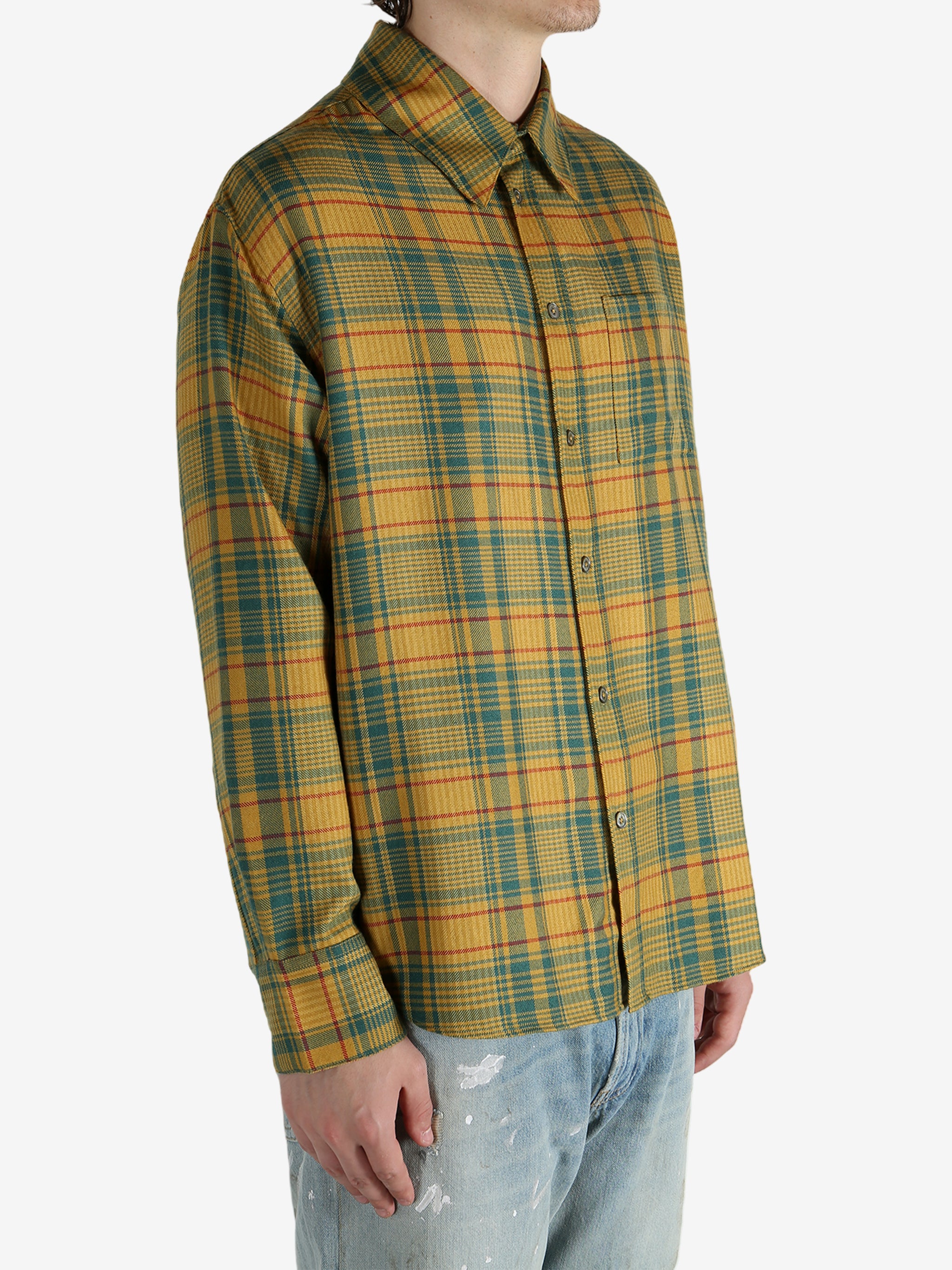 Yellow shirt worn by a person, showing the shirt’s fit