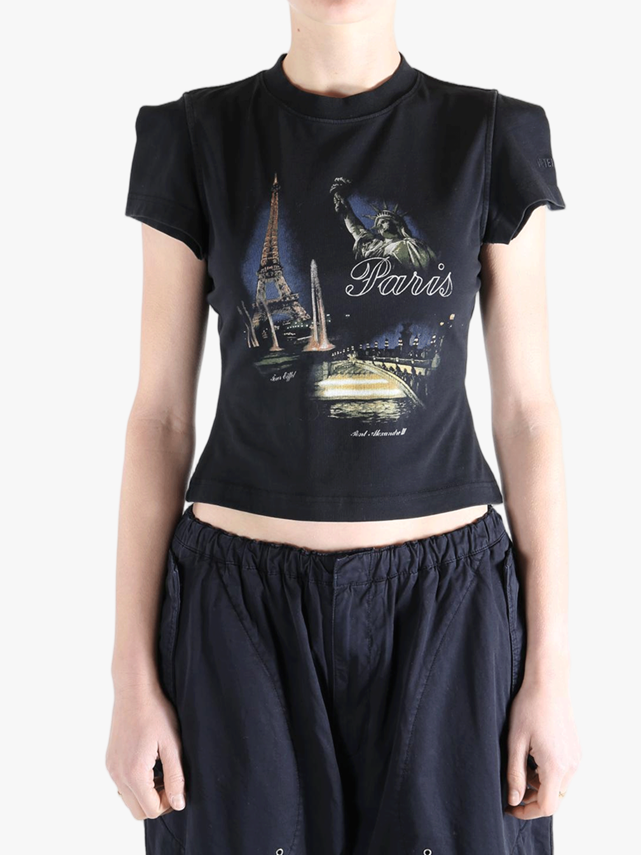 Black t-shirt worn by a person, showing the t-shirt's fit