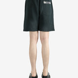 Black shorts worn by a person, showing the shorts’ fit