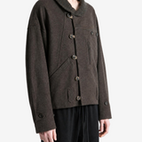 Brown jacket worn by a person, showing the jacket fit