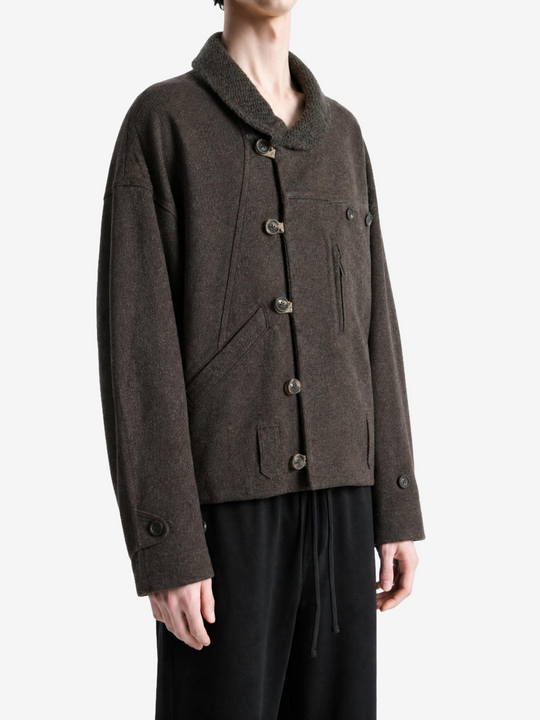 Brown jacket worn by a person, showing the jacket fit