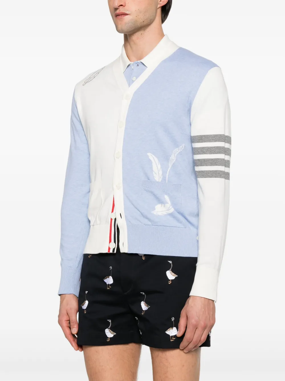 Blue knitwear worn by a person, showing the knitwear's fit