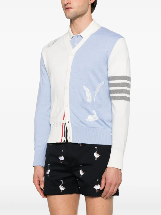 Blue knitwear worn by a person, showing the knitwear's fit