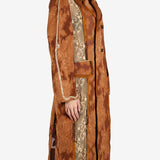 Orange coat worn by a person, showing the coat’s fit