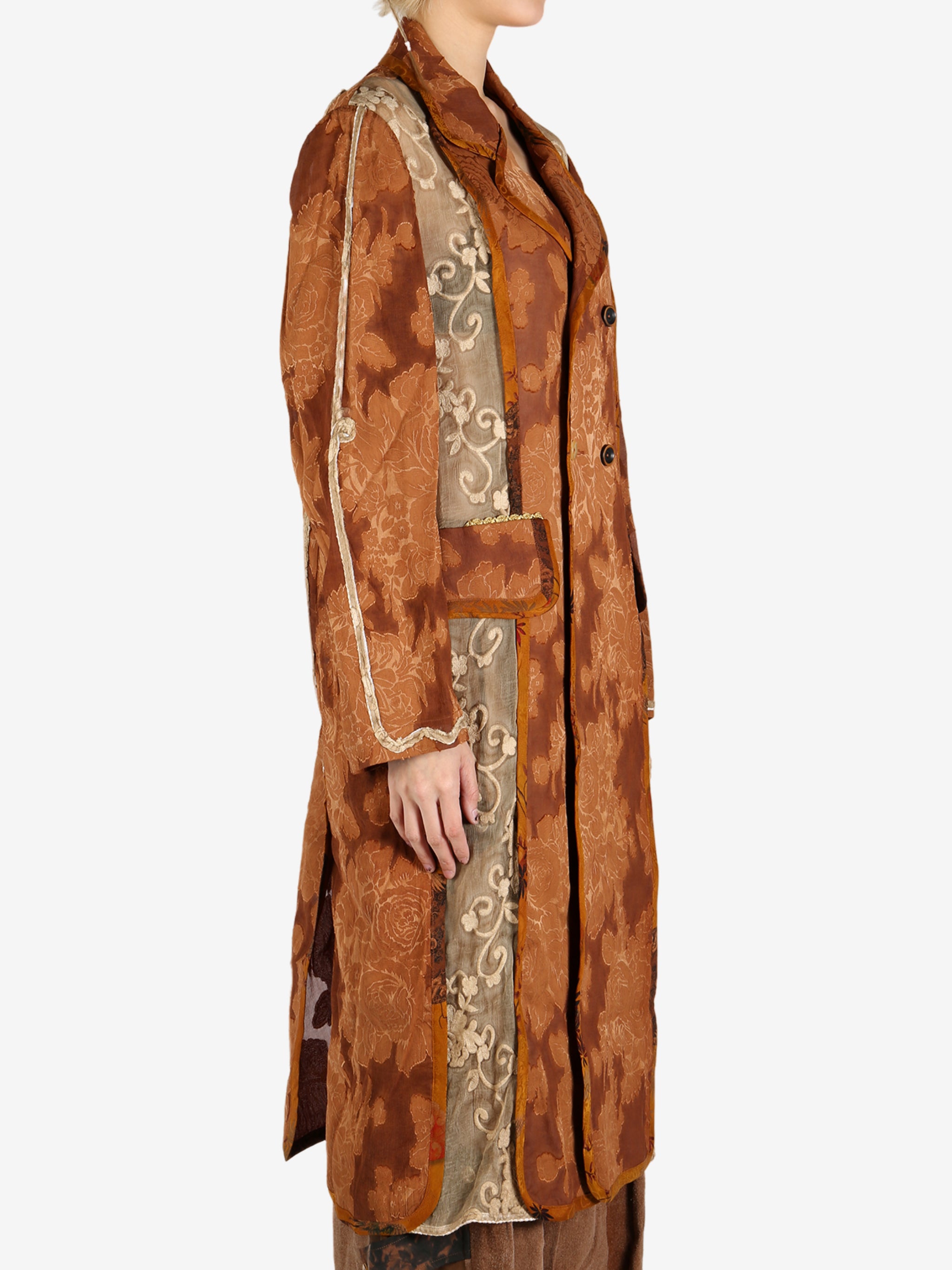 Orange coat worn by a person, showing the coat’s fit