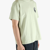 Green t-shirt worn by a person, showing the t-shirt's fit