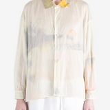 Tan shirt worn by a person, showing the shirt fit