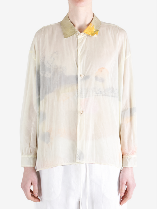 Tan shirt worn by a person, showing the shirt fit