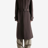 Brown coat worn by a person, showing the coat's fit