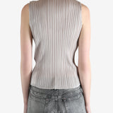 Grey tops worn by a person, showing the  tops fit