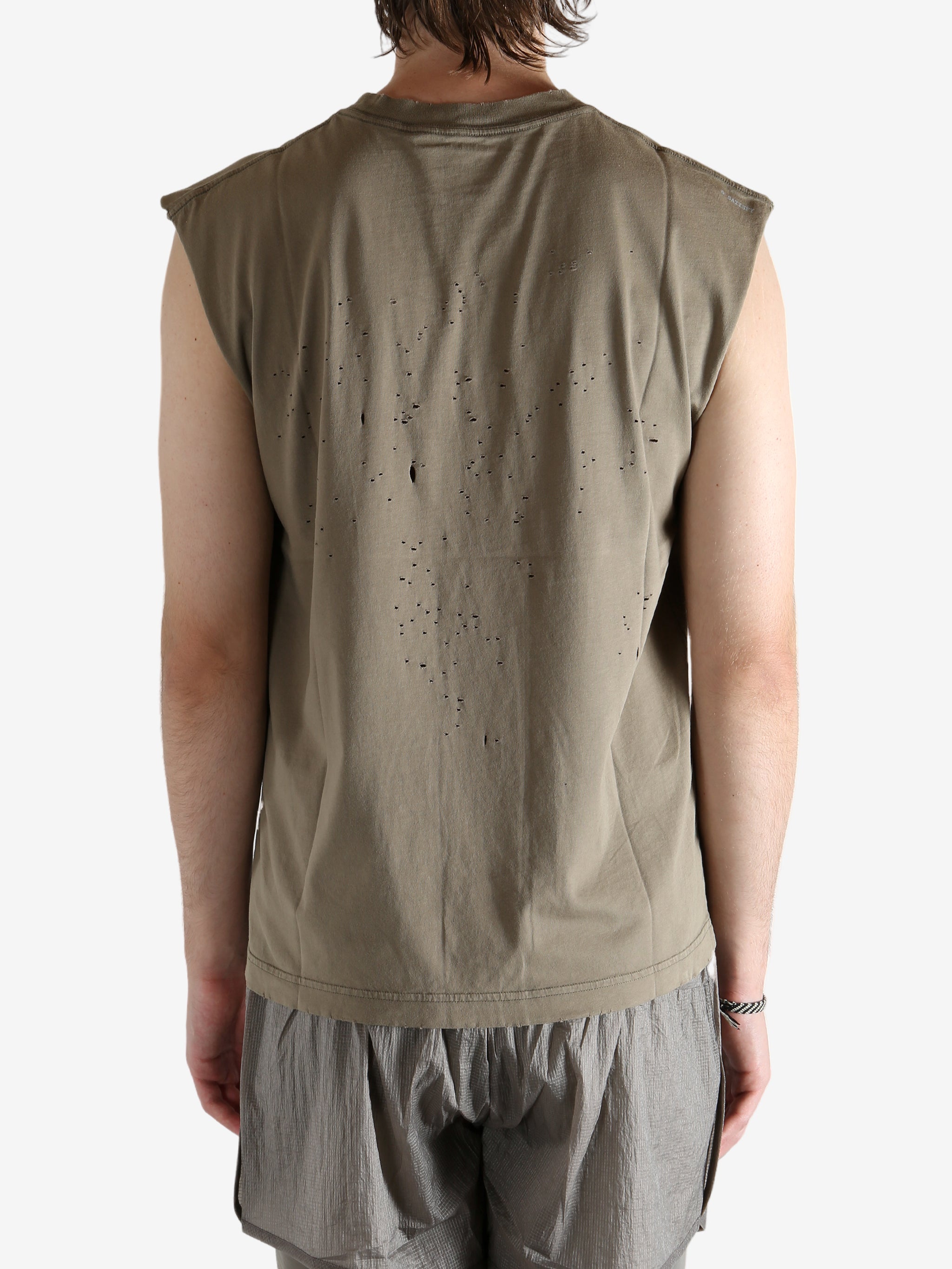 Brown shirt worn by a person, showing the shirt fit