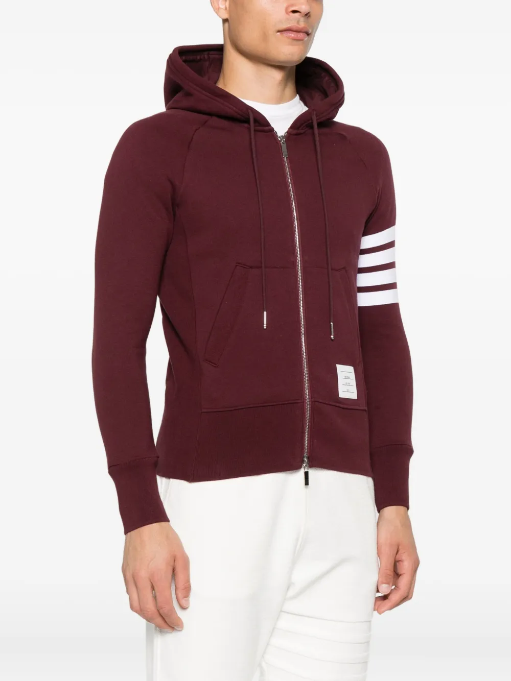 Red hoodies worn by a person, showing the hoodies fit