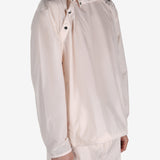 Pink jacket worn by a person, showing the jacket's fit