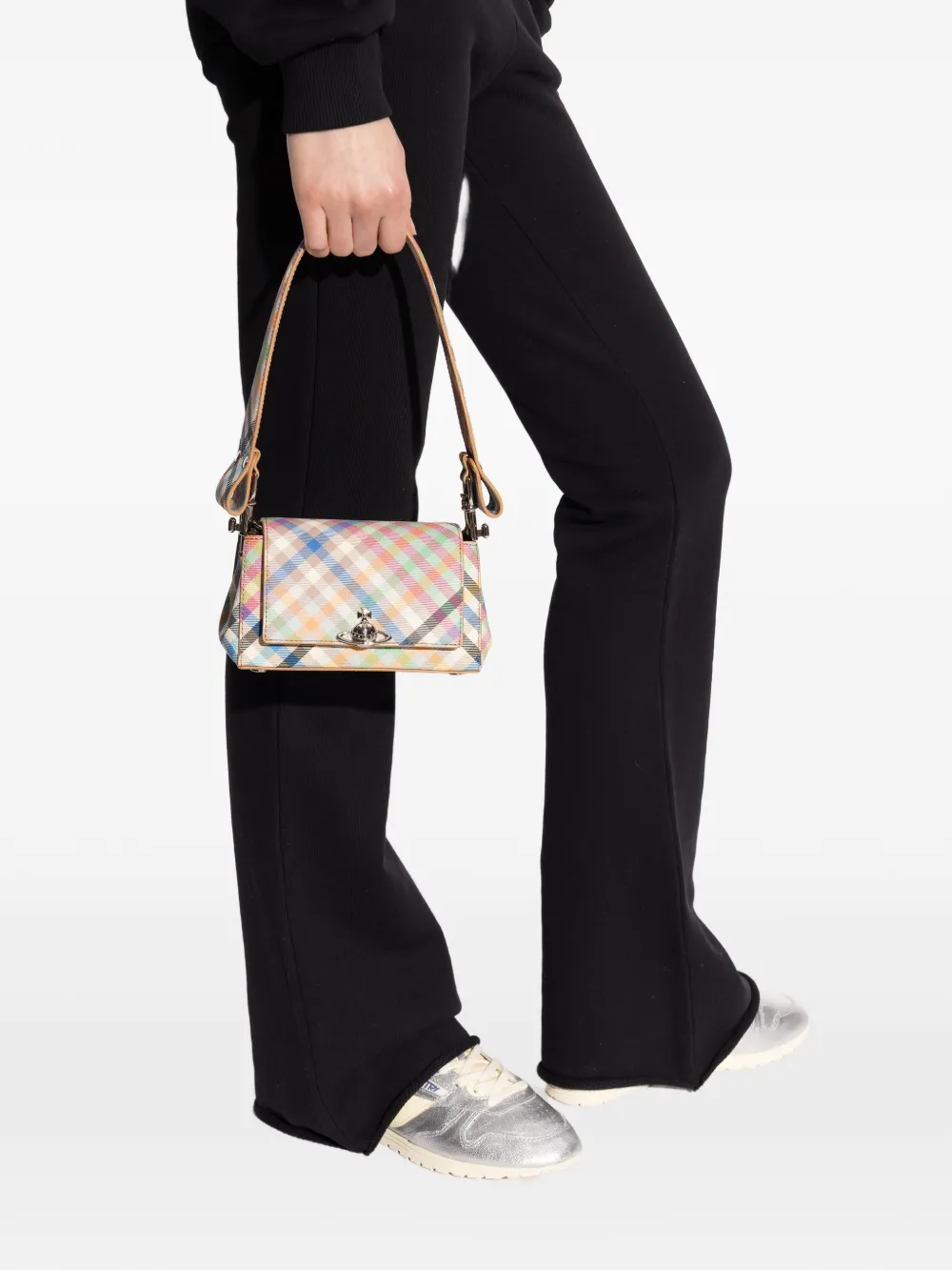Tan bag worn by a person, showing the tan bag's fit