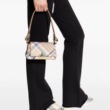Tan bag worn by a person, showing the tan bag's fit