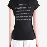 Black t-shirt worn by a person, showing the t-shirt fit