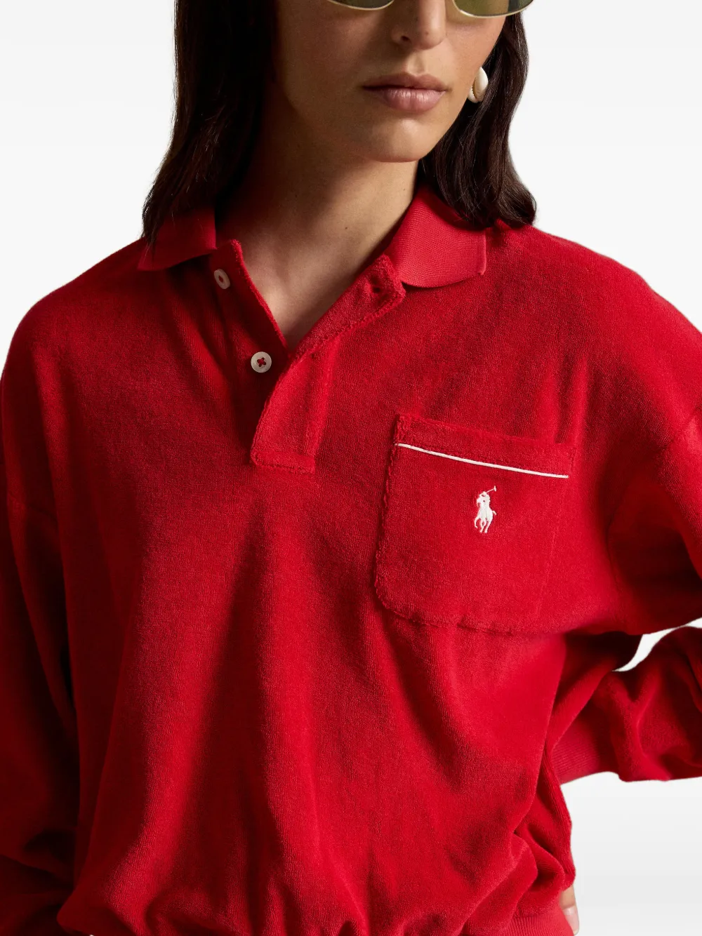 Close up of red knitwear, showing texture of the Cotton and Polyester fabric