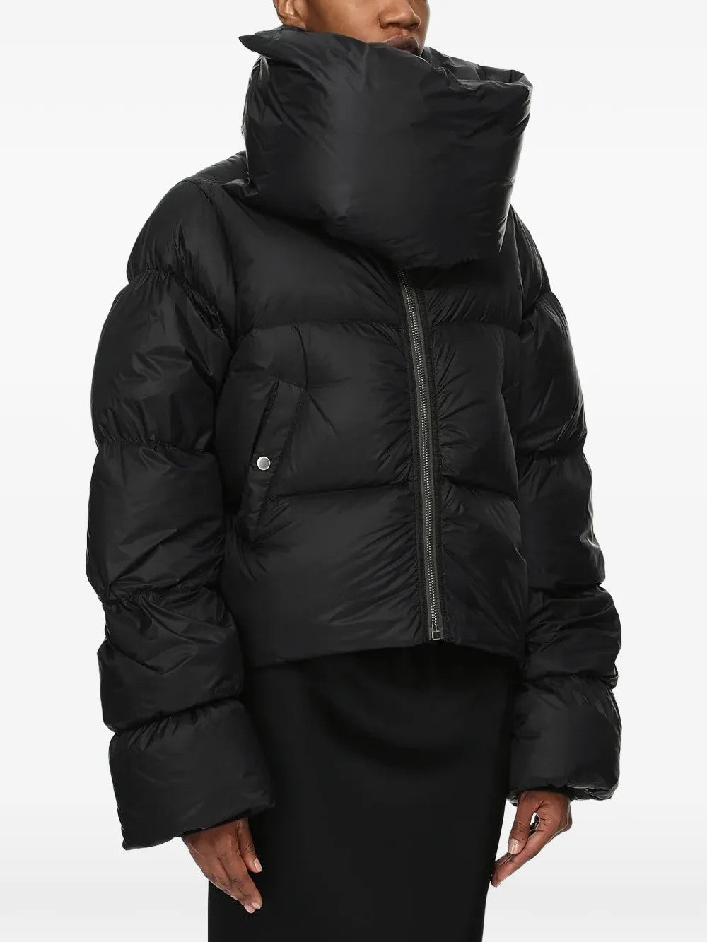 Black jacket worn by a person, showing the jacket fit