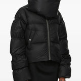 Black jacket worn by a person, showing the jacket fit
