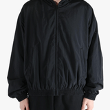 Black jacket worn by a person, showing the jacket's fit