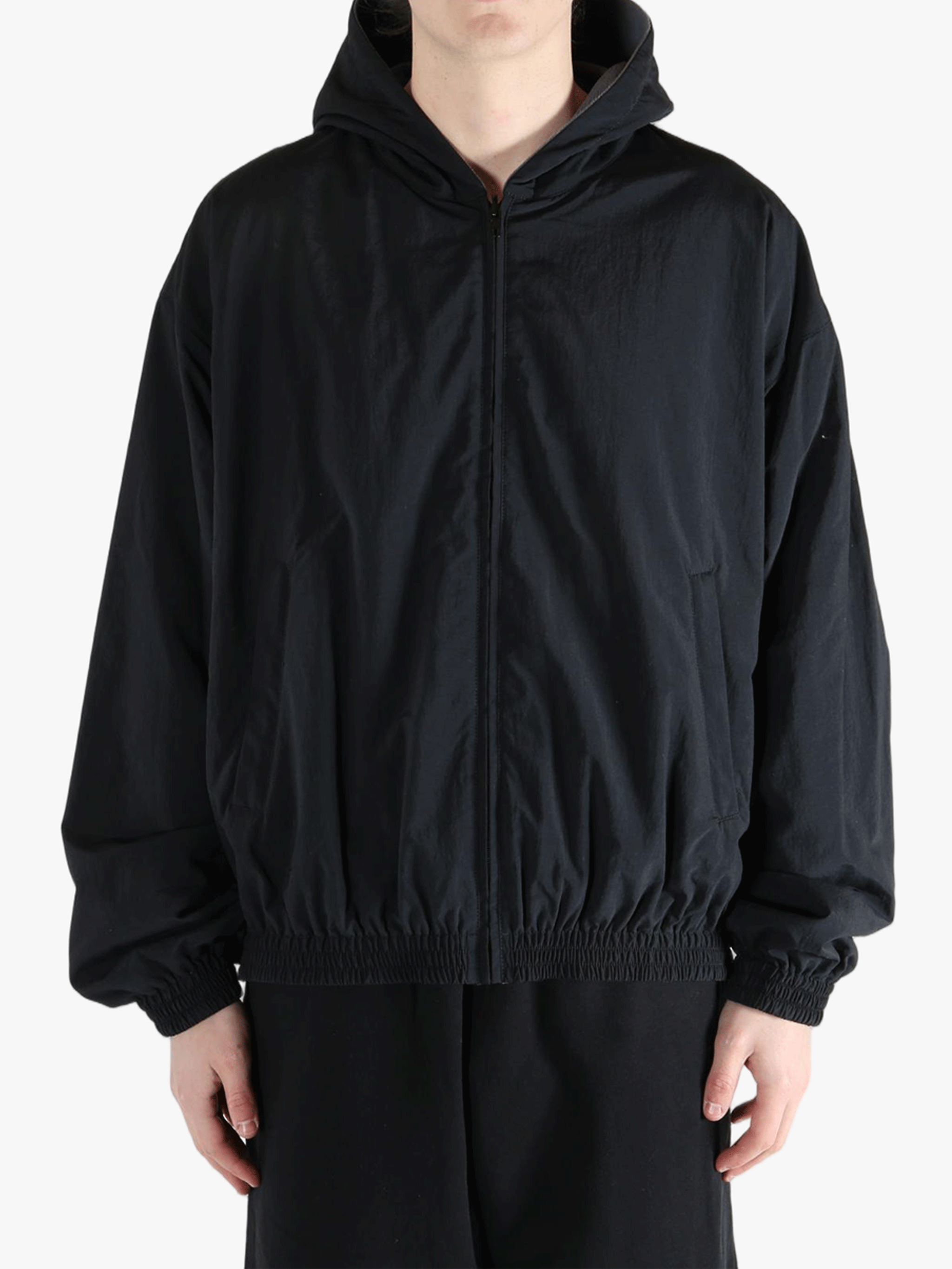 Black jacket worn by a person, showing the jacket's fit