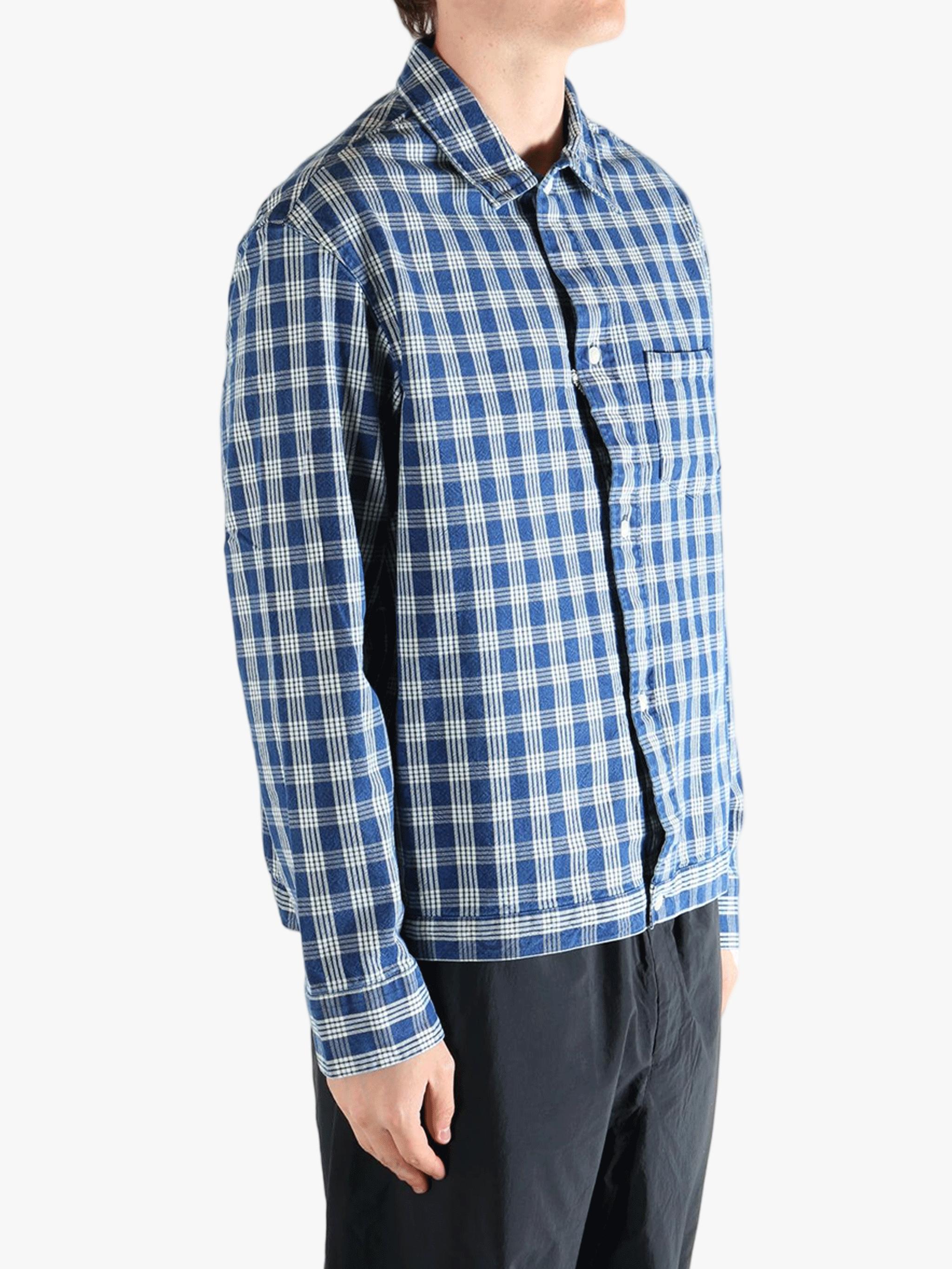 Blue shirt worn by a person, showing the shirt's fit