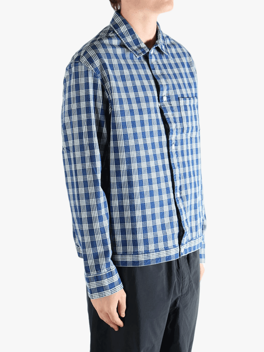 Blue shirt worn by a person, showing the shirt's fit