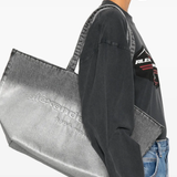 Grey bag worn by a person, showing the bag fit
