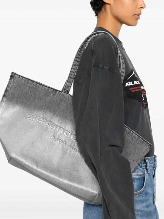 Grey bag worn by a person, showing the bag fit