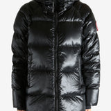 Black coat worn by a person, showing the coat's fit