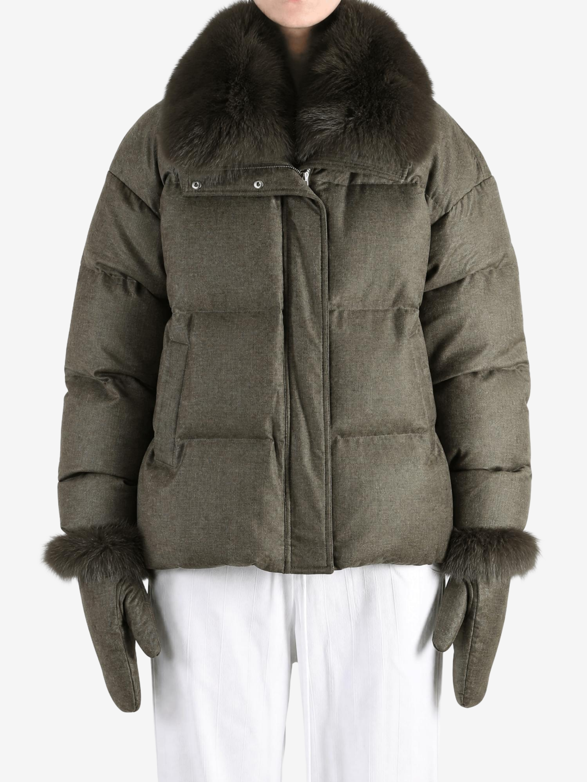 Green jacket worn by a person, showing the jacket fit