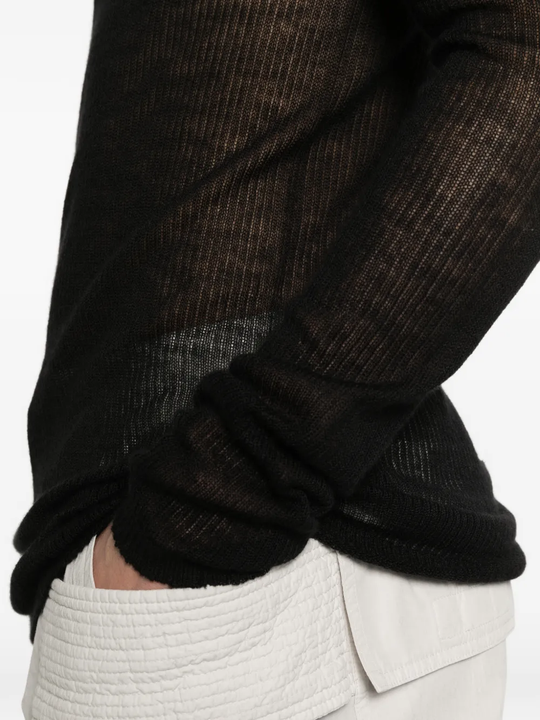 Black t-shirt worn by a person, showing the t-shirt fit