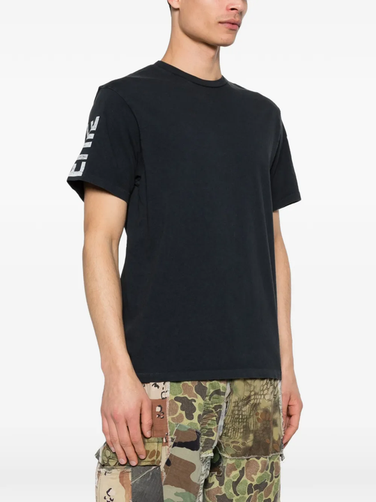 Black t-shirt worn by a person, showing the t-shirt fit